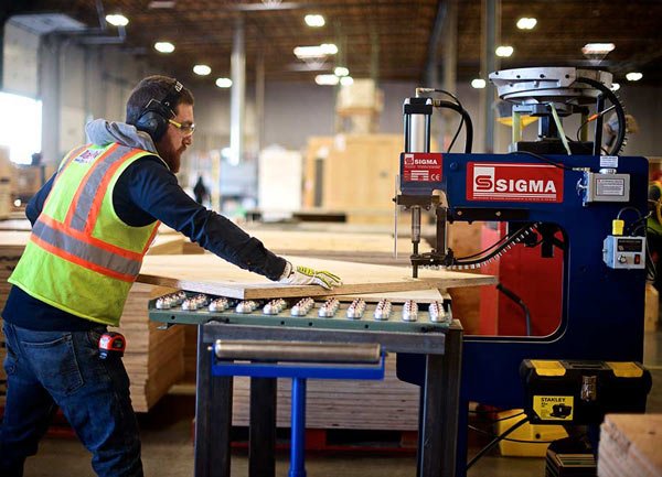 transpak-employee-processing-lumber-for-crate-manufacturing